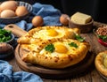 Delicious hachapuri filled with cheese and eggs, and a wooden table covered Royalty Free Stock Photo