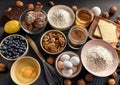 Assorted baking ingredients arranged on a dark surface. Royalty Free Stock Photo