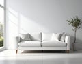 White living room with a minimalist design featuring a sleek, modern sofa with clean lines and four pillows Royalty Free Stock Photo