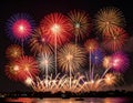Explosive bursts of colorful fireworks light up the night sky Royalty Free Stock Photo