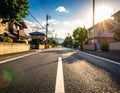 Photo of an empty street in a Japanese suburb, taken on a sunny day at eye level. Royalty Free Stock Photo
