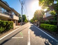 Photo of an empty street in a Japanese suburb, taken on a sunny day at eye level. Royalty Free Stock Photo