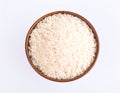 A brown wooden bowl filled with white, long-grain rice sits on a plain white background. Royalty Free Stock Photo