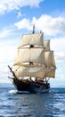 A majestic tall ship with three masts sails on a calm ocean Royalty Free Stock Photo