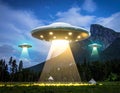 Three large, glowing UFOs hover above a forested mountain landscape, emitting bright beams of light Royalty Free Stock Photo
