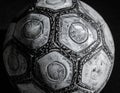A close-up black-and-white image of a worn soccer ball Royalty Free Stock Photo