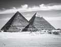 Two of the Giza Pyramids in Egypt, constructed from limestone blocks, are prominently displayed Royalty Free Stock Photo