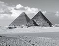 Two iconic pyramids of Giza, Egypt, are depicted in this monochrome image Royalty Free Stock Photo