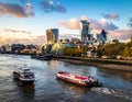 River Thames in London with prominent skyscrapers like the Walkie Talkie, Cheesegrater, and Gherkin visible Royalty Free Stock Photo