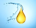 Drop of Omega-3 and water splash on light blue background Royalty Free Stock Photo