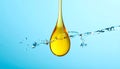 Drop of Omega-3 and water splash on light blue background Royalty Free Stock Photo