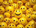 A collection of numerous yellow smiley face balls, each displaying a simple black smile and dot eyes. Royalty Free Stock Photo