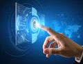 A hand is shown interacting with a futuristic digital interface, touching a holographic display emitting a bright light. Royalty Free Stock Photo