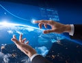 A pair of hands in business attire interact with a transparent digital interface Royalty Free Stock Photo