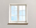 White-framed window with crossbars set in a textured white wall Royalty Free Stock Photo
