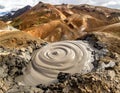 Bubbling gray mudpool with swirling patterns in the foreground Royalty Free Stock Photo