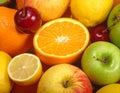 Assortment of fresh fruits includes oranges, lemons, apples, and cherries Royalty Free Stock Photo