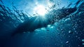 Underwater View of Boat Silhouette - Sunlit Ocean Surface from Below Royalty Free Stock Photo