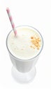 Glass with delicious milk shake on white background, top view Royalty Free Stock Photo
