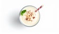 Glass with delicious milk shake on white background, top view Royalty Free Stock Photo