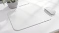 White Mousepad Mockup, Wireless Mouse and Plant on Desk Royalty Free Stock Photo