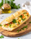 Photo of a fresh, bright sandwich filled with traditional Polish vegetable salad. Royalty Free Stock Photo