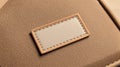 Brown Leather Texture with Blank Beige Label, Sewn Patch Royalty Free Stock Photo
