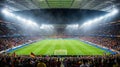 Crowded Soccer Stadium Under Bright Lights During Night Match With Fans Cheering in Packed Stands Royalty Free Stock Photo