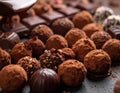 Close up photo of table of cholate include balls, truffles, blocks and melted chocolate Royalty Free Stock Photo