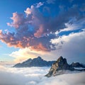Dramatic mountain peaks rise above a thick layer of clouds Royalty Free Stock Photo