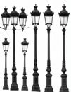 Classically designed street lamps stand in a row against a white background Royalty Free Stock Photo
