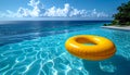 Yellow pool float, floating ring in a refreshing blue swimming pool. Royalty Free Stock Photo