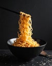 Dark background with golden noodles hovering in the air faithfully ripple Royalty Free Stock Photo