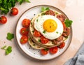 Close-up of a stack of tortillas with egg, sausage and tomatoes on a plate on a table Royalty Free Stock Photo