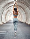 Warm up, fitness and profile woman in tunnel for health, cardio challenge and sports Royalty Free Stock Photo