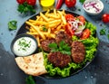 Spicy bifteki, frikadelle or frikkadel meatballs with minced beef and lamb with pita Royalty Free Stock Photo