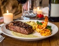 A romantic dinner scene at a restaurant. the couple are having a 12oz Certified angus Royalty Free Stock Photo