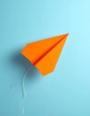 Minimal balloon 3D image of simple hand made paper airplane, made with orange paper Royalty Free Stock Photo