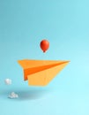 Minimal balloon 3D image of simple hand made paper airplane, made with orange paper Royalty Free Stock Photo