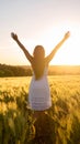 Happy woman on sunset in nature iwith open hands. Happy woman on the sunset in nature Royalty Free Stock Photo