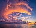 Dramatic sunset over an ocean, featuring a sky Royalty Free Stock Photo