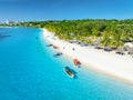 Aerial view of the boats and sea coast with white sandy beach