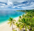 Aerial view of palms, sandy beach of Indian Ocean at sunset Royalty Free Stock Photo