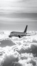 Airplane Flying Over Clouds in Black and White Royalty Free Stock Photo