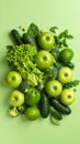 Assortment of Fresh Green Fruits and Vegetables Arranged on a Light Green Background Royalty Free Stock Photo