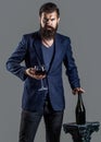 Beard man sommelier tasting drink red wine. Man with a glass of red wine in his hands Royalty Free Stock Photo