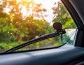 Generated image Car windshield with rain drops and frameless wiper blade closeup Royalty Free Stock Photo