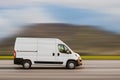 Cargo van is driving on the highway at speed with a blurred background Royalty Free Stock Photo
