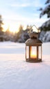 Charming lantern with a candle illuminating snowy landscape at dusk creating warm light in a winter setting promoting Royalty Free Stock Photo