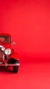 Classic Red Car Vintage Automobile Half View Against Solid Red Background Royalty Free Stock Photo